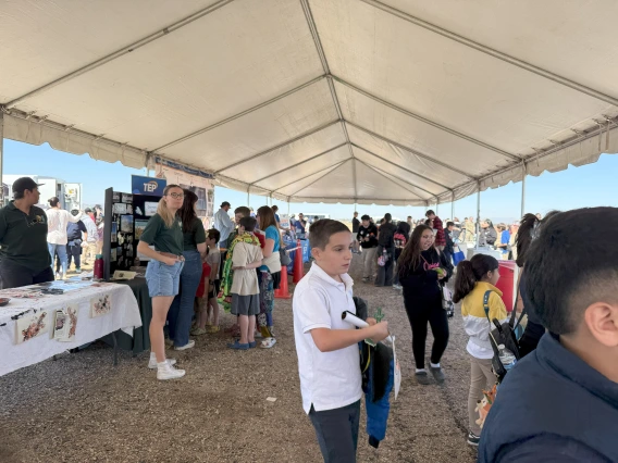 Students in the DMAFB STEAM Village tent.