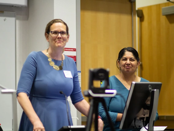 Image of SCORCH CoPIs Kacey Ernst and Mona Arora welcome attendees.