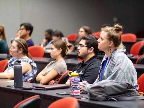 Image of attendees listening to the panel discussion.