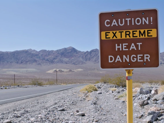 Highway sign wiht text "Caution! Extreme Heat Danger