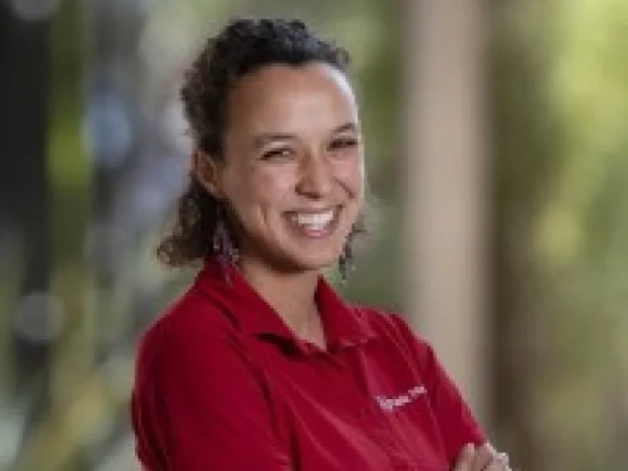 Photo of Maiya Block Ngaybe wearing a red shirt.