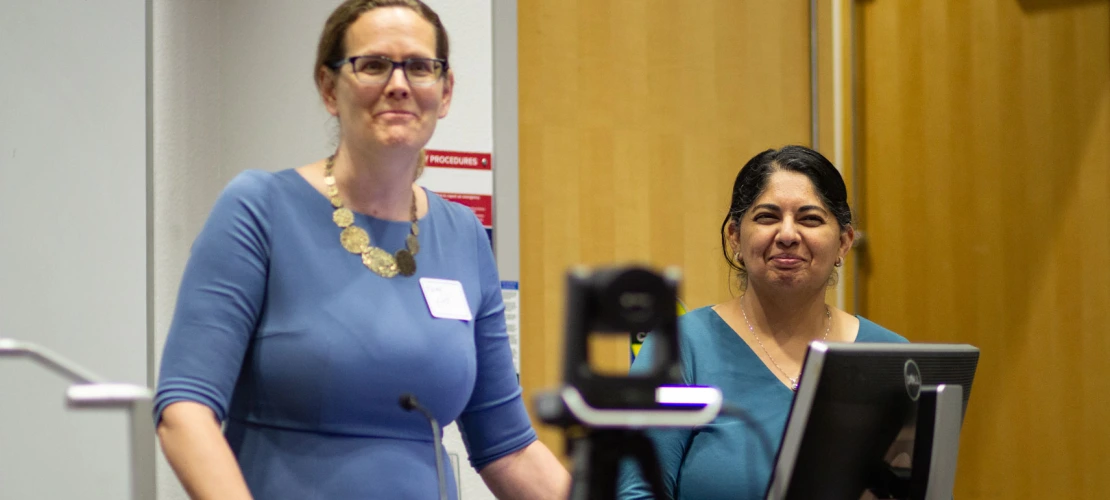 Image of SCORCH CoPIs Kacey Ernst and Mona Arora welcome attendees.