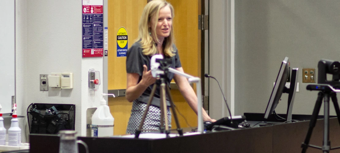 Image of Kate Ellingson (MEZCOPH) describing her farm worker enumeration work.
