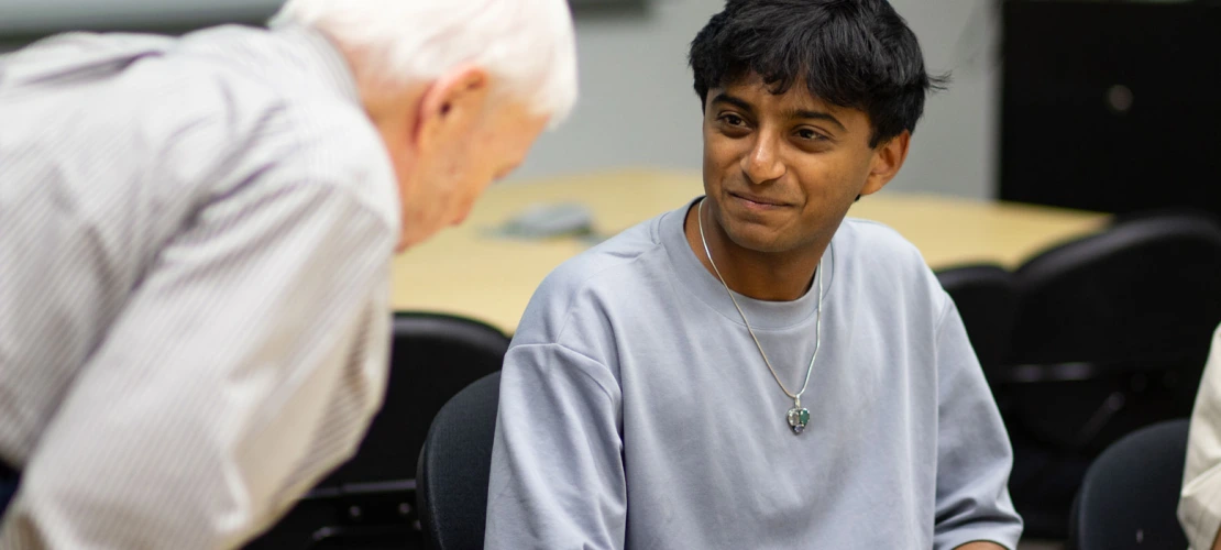 Image of Mark Ginsberg and Ojas Sanghi talking.