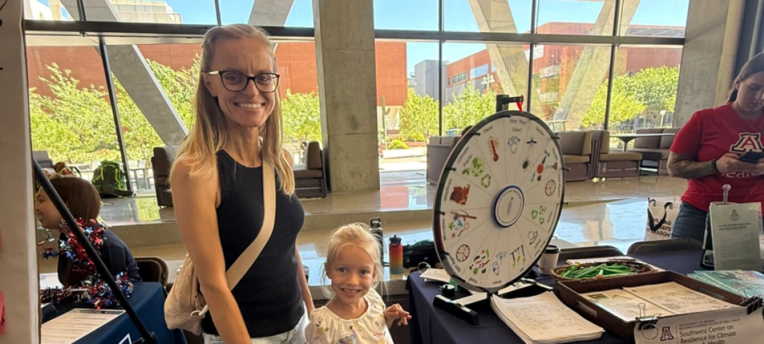 Mom and young daughter at the SCORCH 'Connect 2 STEM' table.