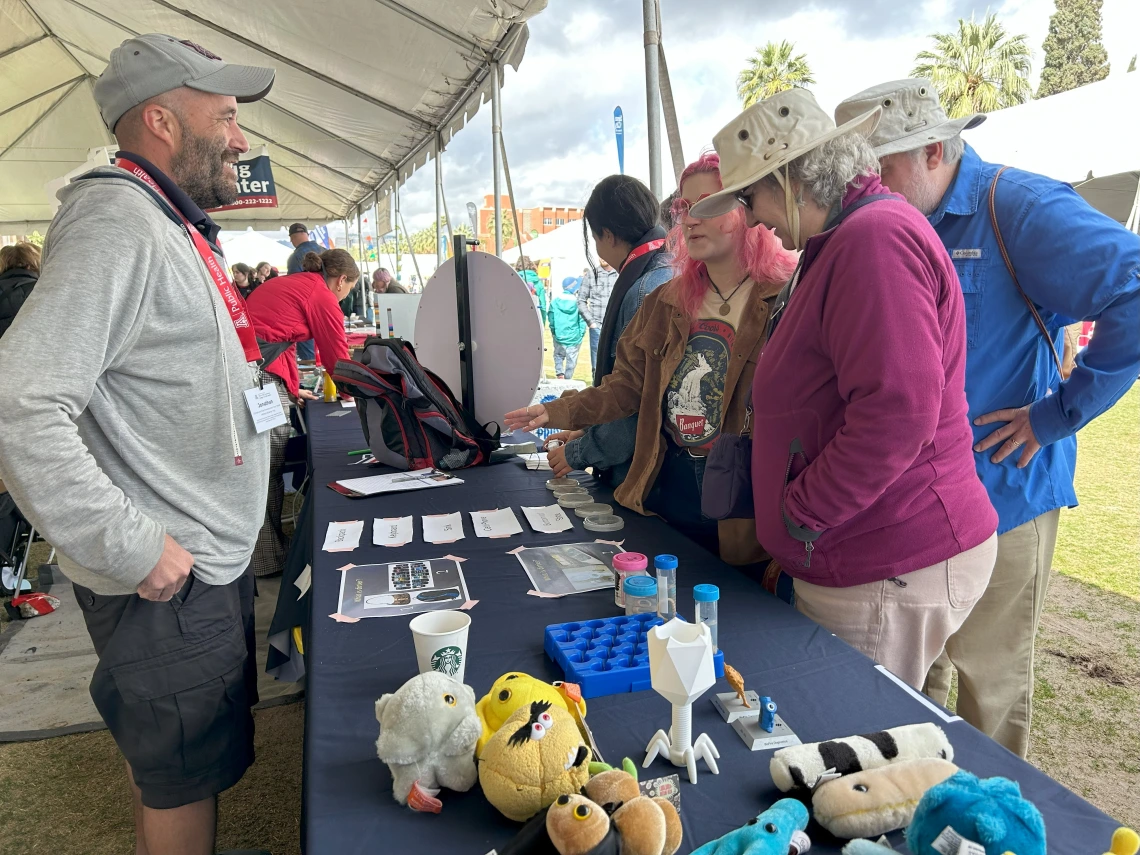 Dr. Jonathan Sexton and participants exploring ESRAC's germ table.