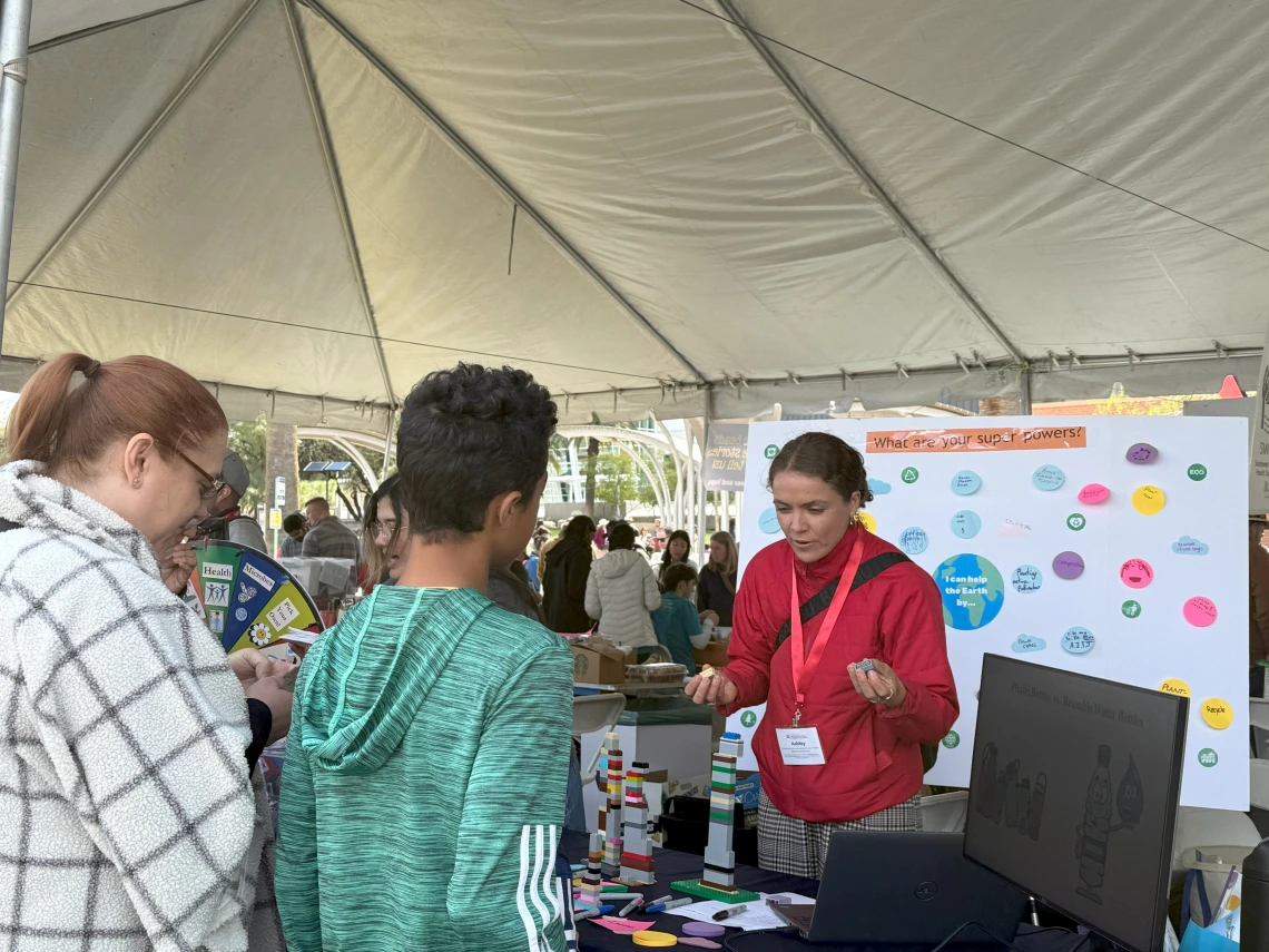 Festival goers illustrating their carbon footprint using LEGO blocks.