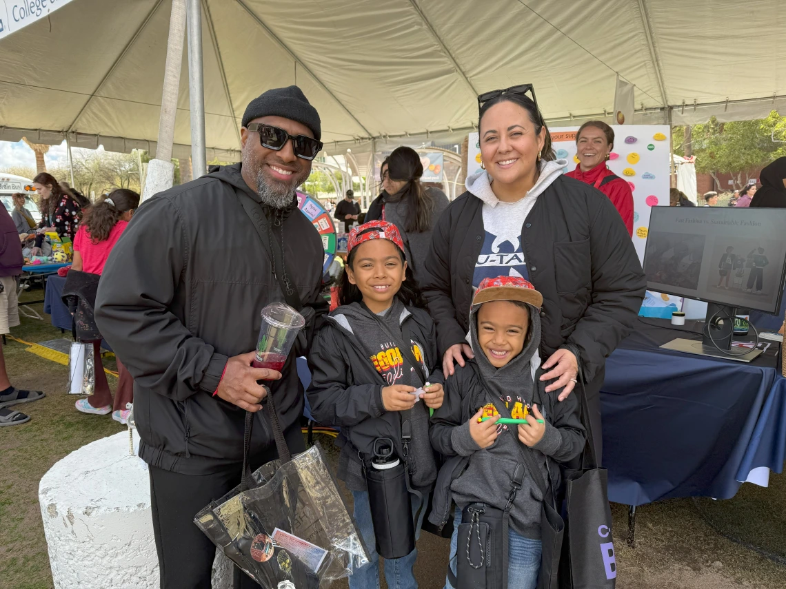 A happy family enjoying the carbon footprint LEGO illustration activity.