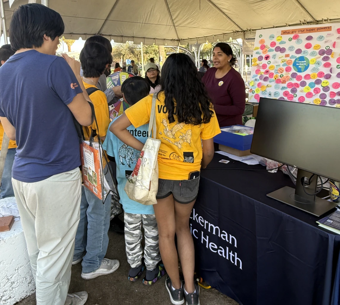 Dr. Mona Arora engaging participants in the spin-the-wheel climate and health trivia game.