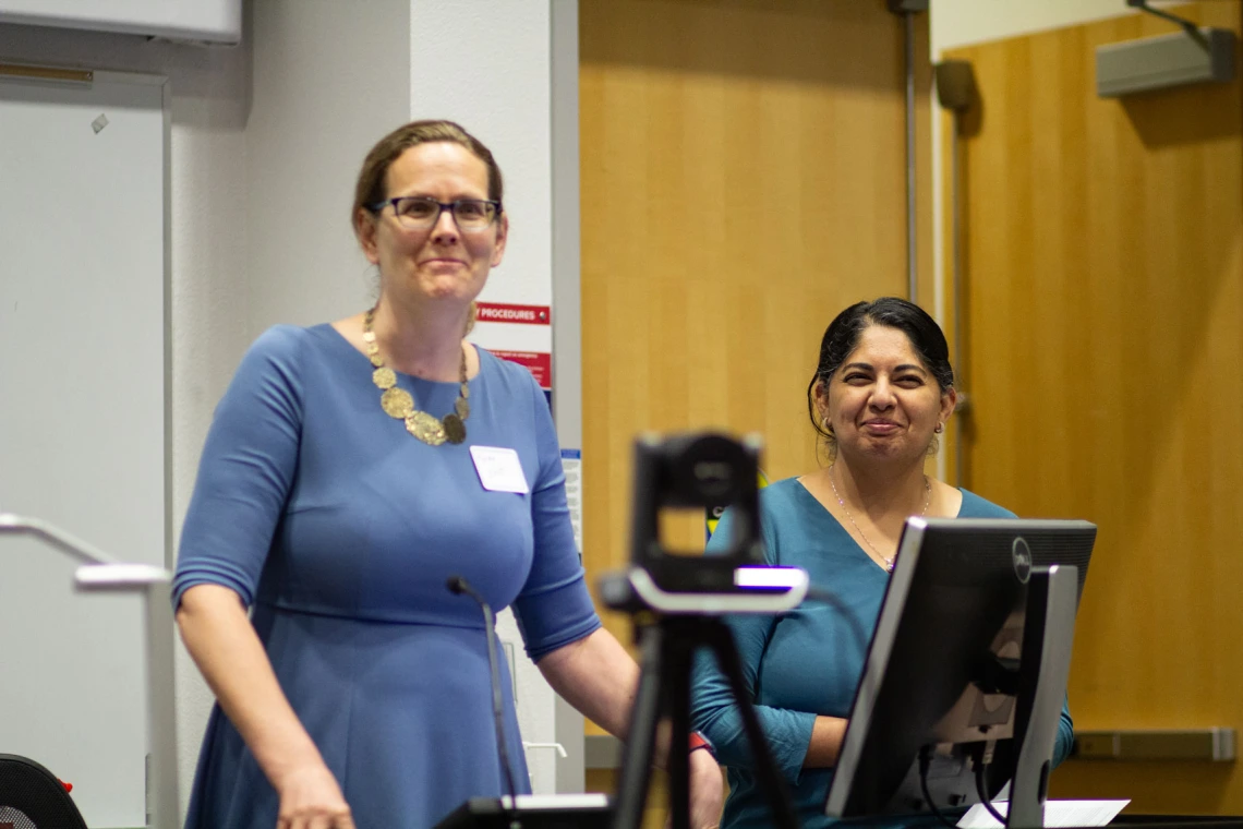 Image of SCORCH CoPIs Kacey Ernst and Mona Arora welcome attendees.