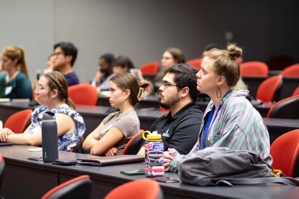 Image of attendees listening to the panel discussion.