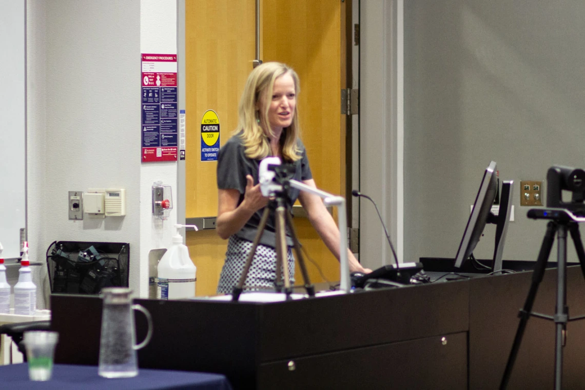 Image of Kate Ellingson (MEZCOPH) describing her farm worker enumeration work.