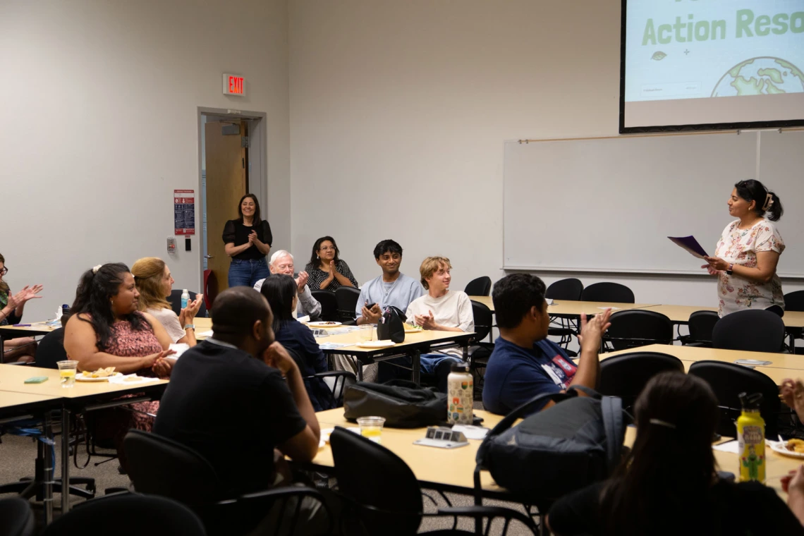 Image of Mona Arora welcoming attendees.