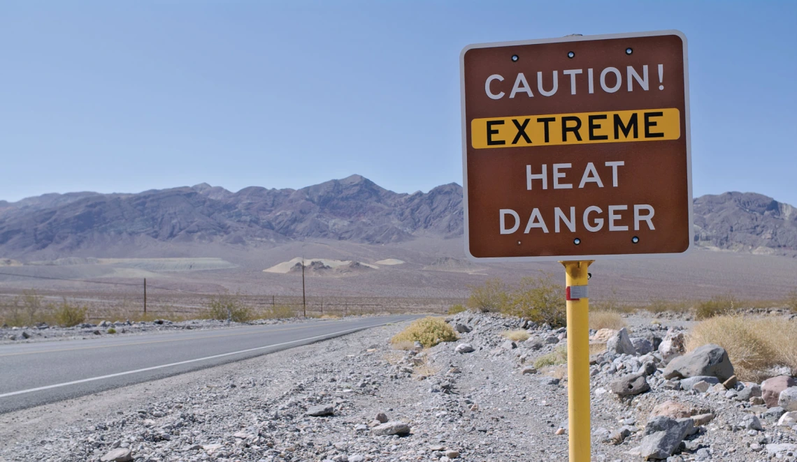 Highway sign wiht text "Caution! Extreme Heat Danger