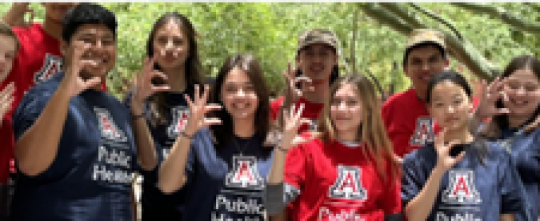 Photo of participating youth wearing UofA shirts in blue and red.