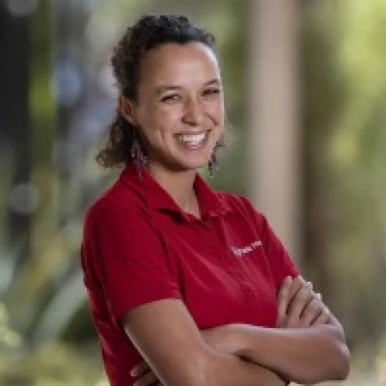 Photo of Maiya Block Ngaybe wearing a red shirt.