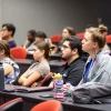 Image of attendees listening to the panel discussion.